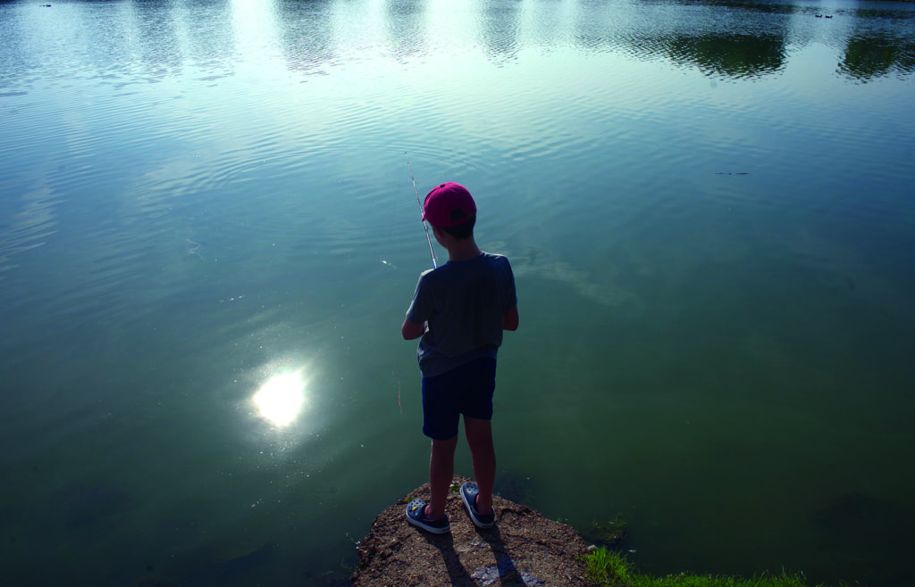 Dexter Wagley concentrating hard on the lake looking for fish to reel in.  At only eight years old, Wagley looked like a pro on Saturday.